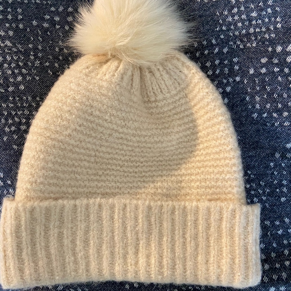 Cream colored wool Pom Pom beanie. Brand new